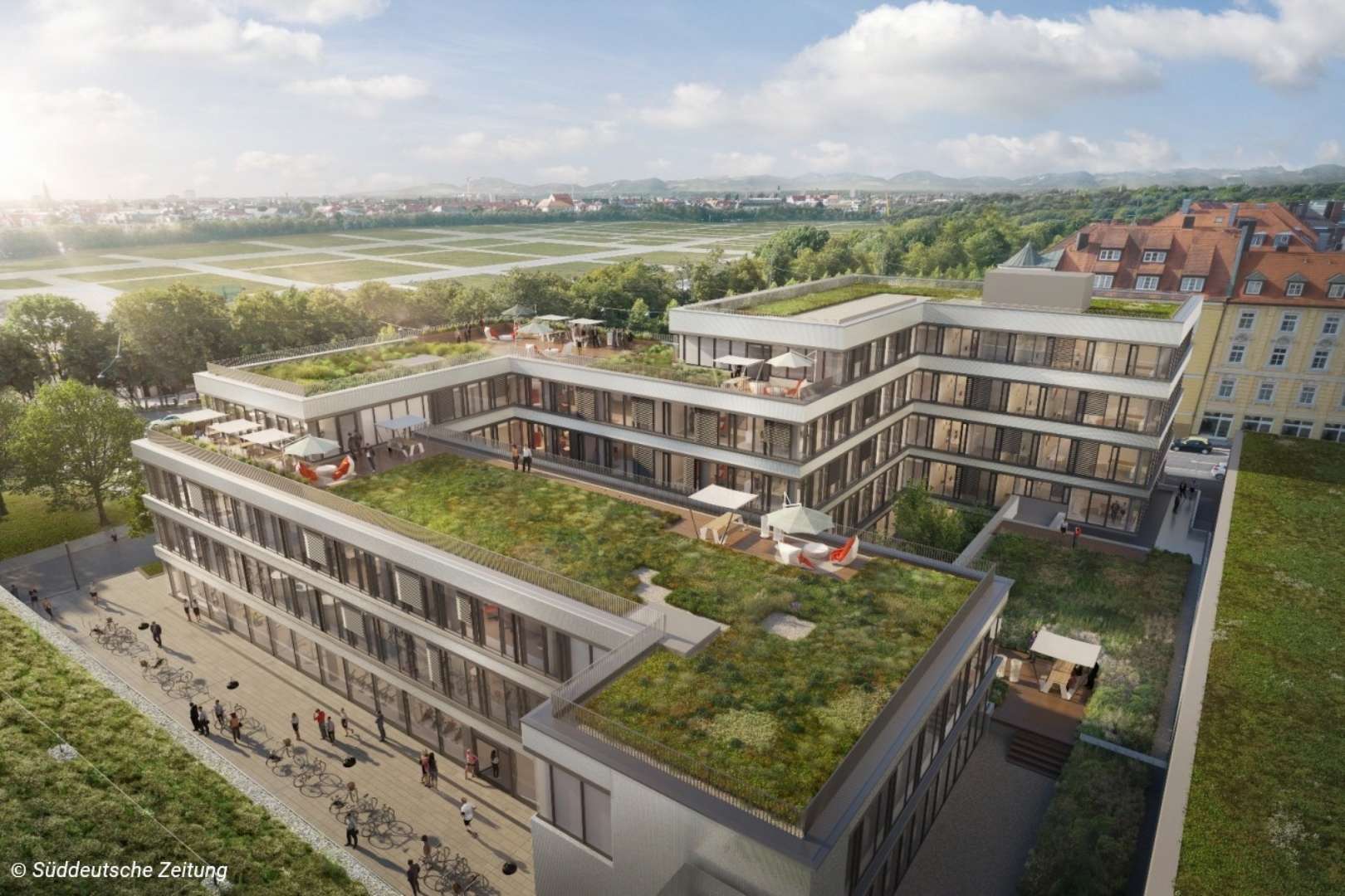 Modernes Wohngebäude mit begrünten Dachterrassen und großflächiger Glasfassade in einer Flusslandschaft.